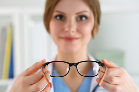 bigstock Female Oculist Doctor Hands Gi 163866446